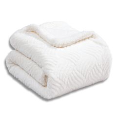 two white blankets stacked on top of each other