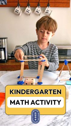 a young boy is playing with some sort of math activity for kids to practice their fine motor skills