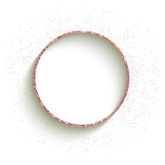 a circular object with pink and white speckles on the surface, as if it was made out of paper