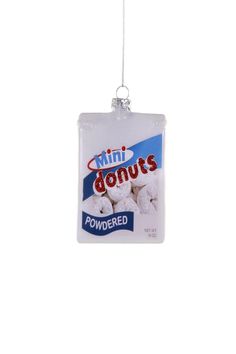 mini donuts ornament hanging from a string on a white background with the words,'tiny donuts powdered '