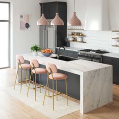 a modern kitchen with marble counter tops and bar stools