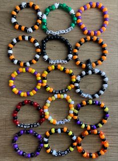 several bracelets with different colored beads and words on them