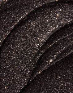 black glitter fabric with white stars on it