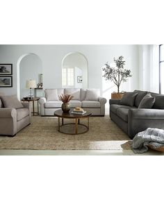 a living room with two couches and a coffee table