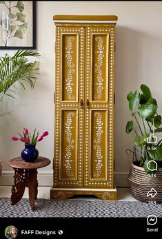 a tall wooden cabinet sitting next to a potted plant