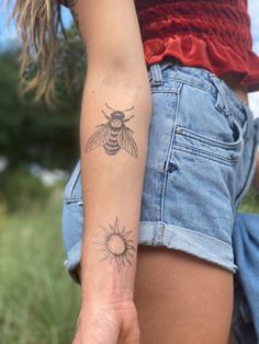 a woman with a tattoo on her arm