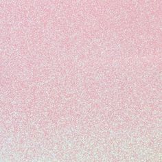 a pink and white background with small speckles