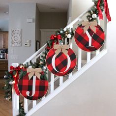 christmas decorations are hanging on the banister