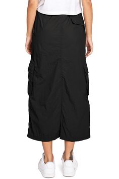 Chic, parachute skirt with an elastic waistband, a drawstring cinch tie and cargo pockets down the sides. Pair it with a graphic tee and sneakers for an effortless streetwear look. CARE | Machine Wash Cold CONTENTS | 100% Nylon MEASUREMENTS | 33"/85 cm Top to Bottom (Size Small) MODEL | 5'8 - wearing a size Small IMPORTED Casual Drawstring Cargo Skirt For Summer, Casual Cargo Skirt With Drawstring For Summer, Casual Summer Cargo Skirt With Drawstring, Spring Utility Cargo Skirt With Drawstring, Utility Cargo Skirt With Elastic Waistband, Casual Black Cargo Skirt For Summer, Casual Cotton Cargo Skirt With Elastic Waistband, Casual Baggy Cargo Skirt For Spring, Black Casual Cargo Skirt For Streetwear