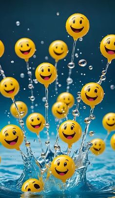 yellow smiley face balloons floating in the water with bubbles coming out of them and splashing around