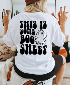 Add some fun to your Halloween wardrobe with our "This Is Some Boo Sheet Shirt"! Made with 100% cotton, this tee is perfect for any Halloween event. Get ready to spook and spook on! White Horror T-shirt For Halloween, White Horror T-shirt For Fall, White Horror T-shirt With Letter Print, Spooky White Shirt With Letter Print, Soccer Tees, Boo Sheet, Halloween Hoodie, Trendy Halloween, Fall Hoodies