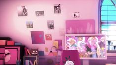 a room with pink walls and pictures on the wall