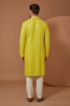 Bright yellow silk kurta with thread and mirror hand embroidery. Comes with pant. - Aza Fashions Pista Green Long Sleeve Kurta With Mirror Work, Silk Sherwani With Mirror Work In Straight Kurta Style, Silk Sherwani With Mirror Work, Straight Kurta, Yellow Designer Wear Sherwani Straight Kurta, Silk Sherwani With Mirror Work, Yellow Silk Traditional Wear With Mirror Work, Traditional Yellow Chanderi Sherwani, Yellow Sherwani With Resham Embroidery In Chanderi, Yellow Chanderi Sherwani With Traditional Drape