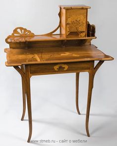 an old wooden desk with wheels and drawers on it's legs, against a white background