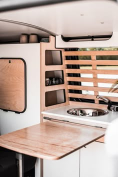 the kitchen is clean and ready to be used as a dining area in this camper