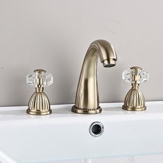 two faucets are shown in this bathroom sink