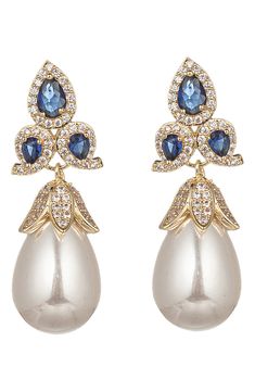 Royal blue cubic zirconia stones add a pop of color to a set of elegant drop earrings that are the perfect finishing touch for any special occasion look. Post back Brass/cubic zirconia Imported Blue Bridal Earrings, Navy Earrings, Bridal Statement Earrings, Earrings Dangling, Blue Bridal, Statement Earring, Fancy Jewellery, Cz Earrings, Keep Jewelry