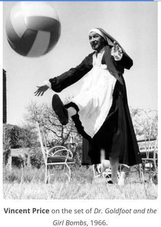 an old photo of a woman playing with a ball