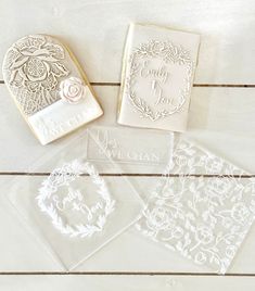 three clear stamps with flowers on them and one has a heart shaped stamper in the middle