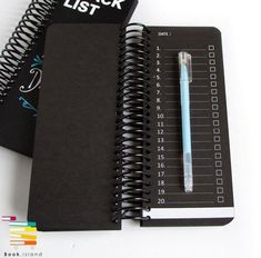 a notebook with a pen and check list next to it