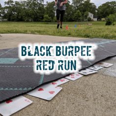 a black burpee red run mat on the ground