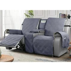 the reclining loveseat has two matching covers on it