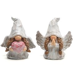 two wooden angel figurines holding a heart