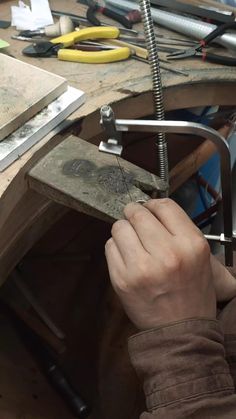 a person working on a piece of wood