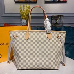 Description L.V Neverfull MM Tote Bag Damier Azur Canvas For Women, Women’s Handbags, Shoulder Bags 12.2in/31cm LV N41361 Rep 1:1 The Neverfull MM tote unites timeless design with heritage details. Made from fresh Damier Azur canvas with natural trim, it is roomy yet not bulky, with side laces that cinch for a sleek allure or loosen for a casual look. The slim handles slip easily over the shoulder or arm. Lined in colorful textile, it features a removable pouch which can be used as a clutch or an extra pocket. 31 x 28 x 14 cm / 12.2 x 11 x 5.5 inches (Length x height x width) Beige Damier Azur coated canvas Striped textile lining Gold-color hardware 4 side laces Hook closure Flat, textile-lined zipped inside pocket Removable zipped pouch D-ring Handle: Double –  Includes dust bag. –  This Louis Vuitton Gm, Louis Vuitton Mm, Louis Vuitton Top, Louis Vuitton Favorite Mm, Lv Neverfull Mm, Louis Vuitton Travel Bags, Lv Neverfull, Neverfull Mm Monogram, White Tote Bag