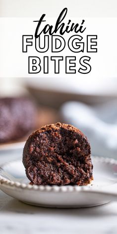 a chocolate muffin on a white plate with the words falafai fudge bites above it