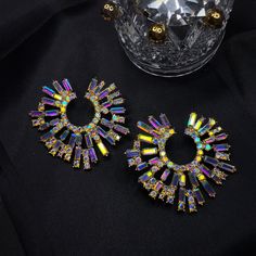 These statement earrings will grab everyone's attention! Perfect to glam up and rock that party! Product Description: 925 sterling silver post, crystals Lead and Nickle Free Hypoallergenic, great for sensitive ears Please scroll down for additional info about jewelry care. Rainbow Explosion, Crystal Heart Earrings, Goth Jewelry