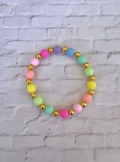 This bracelet is handmade and made to order. The length is customizable and it comes in two styles, gold or clear beads.  Perfect for teachers, student teachers, coworkers, bosses, or as a stocking stuffer! -Follow me on Instagram @chanslans Gold Friendship Bracelets With Colorful Beads For Birthday, Birthday Gold Friendship Bracelets With Colorful Beads, Casual Gold Stretch Bracelet With Colorful Beads, Cute Gold Beaded Stretch Bracelet, Gold Stretch Bracelet With Colorful Beads For Birthday, Gold Bracelets With Colorful Beads For Birthday, Trendy Gold Beaded Bracelet For Birthday, Casual Gold Bracelets With 8mm Beads, Casual Gold Stretch Bracelet For Gift