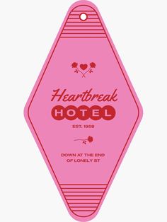 the heart break hotel sign is pink with red lettering and two hearts on it's side