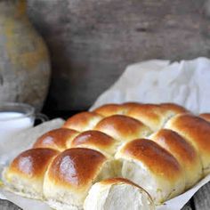 a loaf of bread sitting on top of a piece of wax paper