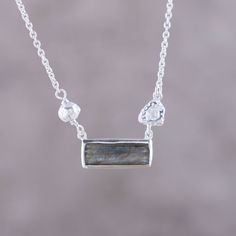 Neetu Barathi of India designs a sleek, modern pendant necklace that features a rectangular faceted labradorite gemstone set in sterling silver. The pendant connects on each end to a sterling silver cable chain, accented with textured sterling silver nuggets. The chain has multiple loops for securing the clasp in order to adjust the necklace length to fit. Sterling Silver Toe Rings, Silver Toe Rings, Labradorite Necklace, Sterling Silver Necklace Pendants, Labradorite Pendant, Silver Pendants, Silver Pendant Necklace, Sterling Silver Pendant, Sterling Silver Necklaces