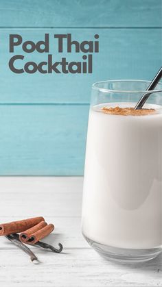 there is a glass of milk and cinnamon sticks next to it on the table with text overlay that reads pod thai cocktail