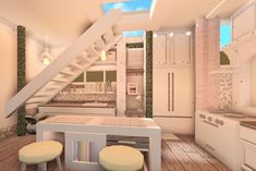 a white kitchen and dining area with stairs leading up to the second floor, along with stools