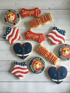 decorated cookies are arranged in the shape of american flags and heart - shaped cookies with words on them