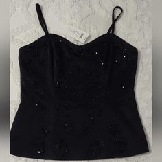 Check Out This Gorgeous New Old Stock Black Beaded Corset Top With Adjustable Straps And A Sexy Zip Up Back. Fully Lined And Silky Smooth. Size Medium. Straps Are Removable As Well. Never Worn. Tags Attached And Comes With Replacement Beads. 16.25" Armpit To Armpit 16" Total Length Not Including Adjustable Straps Smoke Free Home Fast Shipping Elegant Embellished Summer Corset, Elegant Summer Embellished Corset, Black Sequined Corset, Summer Embellished Corset For Night Out, Black Embellished Sleeveless Corset, Black Sleeveless Embellished Corset, Black Sequined Corset For Night Out, Embellished Elegant Corset For Night Out, Elegant Embellished Corset For Night Out