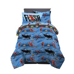 a blue bed with batman and robin justice print on the cover, along with two pillow cases