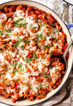 a casserole dish filled with pasta and sauce