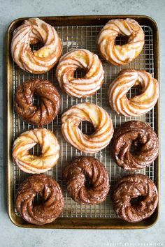 freshly baked doughnuts on a cooling rack ready to be eaten and served for consumption