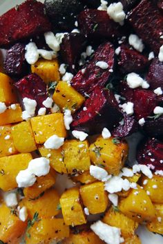 roasted beets, carrots and feta cheese on a plate