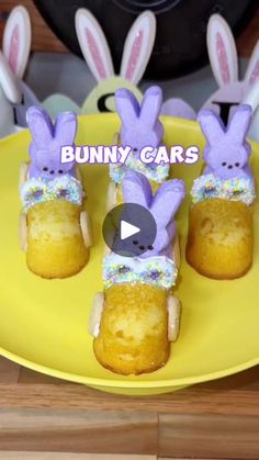 some bunnies with bunny ears are on a yellow plate