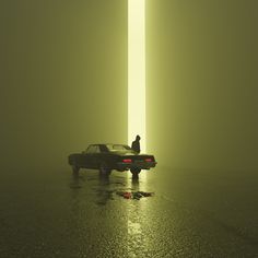 two people sitting on the hood of a car in front of a tall column that is partially obscured by fog