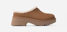 We see you in your clog era, and we're about to show you something to embrace this evolution fully: the New Heights Cozy Clog. They're crafted with suede, lined with upcycled UGG®plush, and set upon a lightweight EVA outsole. Channeling cottage-meets-metropolis with Twin Seam details and a chic 2 inch heel, there's virtually no place that doesn't call for the Cozy Clog. | Suede upper. Twin-seam detailing. 7mm UGG®plush 60% upcycled wool, 40% TENCEL Lyocell lining, 10mm UGG®plush 60% upcycled wool, 40% TENCEL Lyocell vamp lining. 10mm UGG®plush 60% upcycled wool, 40% TENCEL Lyocell insole. Foam footbed. EVA outsole. 2 inch heel height. Heat-embossed UGG® logo. RN 88276. | UGG® Women's New Heights Cozy Clog Suede Shoes in Chestnut, Size 12 Wip Bag, Ugg Womens, Men's Beanies, Saltwater Sandals, Crocs Classic Clogs, Water Sandals, Ugg Classic, Classic Boots, Sandals Brands