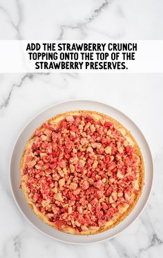 a pizza with toppings sitting on top of a white plate next to a marble counter