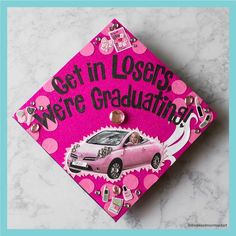 a pink graduation cap with the words get in loses, we're graduating