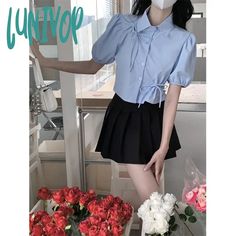 Lunivop Sweet Bow Shirts Women Streetwear Hollow Out Folds Crop Tops Summer Korean Kawaii Fashion Puff Short Sleeve Tunic Tops New Sleeve Length(cm): short（4-16inch） Sleeve Style: puff sleeve Clothing Length: short（4-16inch） Style: Streetwear Material: POLYESTER Decoration: Bow Closure Type: Single Breasted Fabric content: 81% (inclusive) - 90% (inclusive) Gender: WOMEN Pattern Type: Solid Collar: Polo-Neck Fabric Type: Broadcloth Shirts Type: Casual Shirts Korean Kawaii, Short Sleeve Tunic Tops, Women Streetwear, Bow Shirts, Summer Crop Tops, Short Sleeve Tunic, Trendy Collection, Shirts Women, Polo Neck