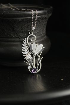 ITEM DESCRIPTION: The size H 5 cm x W 3 cm (2 x 1 inch). Weight - 4 g. You can buy it with a silver chain or without it. I made this unique Crocus pendant of sterling silver, dark amethyst, and moonstone. This is similar to the first spring flowers that appear from under the snow. The floral necklace looks so gentle and elegant! This handmade necklace will come to you in a gift box - ready for gifting. The parcel will be sent 1-2 days after payment. Delivery usually takes 10-21 days. But in the Purple Sterling Silver Flower Pendant Jewelry, Spring Birth Flower Jewelry, Purple Sterling Silver Jewelry With Flower Charm, Sterling Silver Jewelry With Purple Flower Charm, Nature-inspired Flower Pendant Jewelry For Mother's Day, Nature-inspired Purple Flower Jewelry, Purple Flower Nature-inspired Jewelry, Purple Nature-inspired Flower Jewelry, Silver Nature-inspired Necklace With Flower Charm